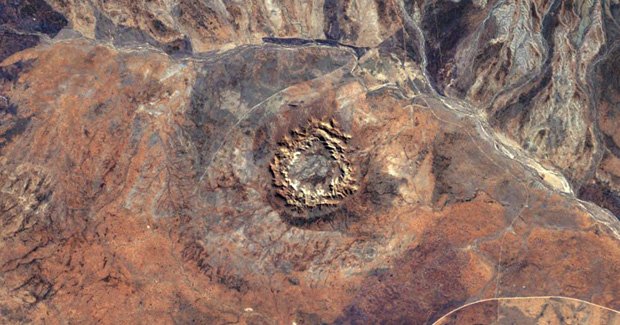 The impact crater was caused by an asteroid slamming into Earth between 298 and 360 million years ago, which places it in the same epoch as the Late Devonian mass extinction [Credit: NASA Earth Observatory]